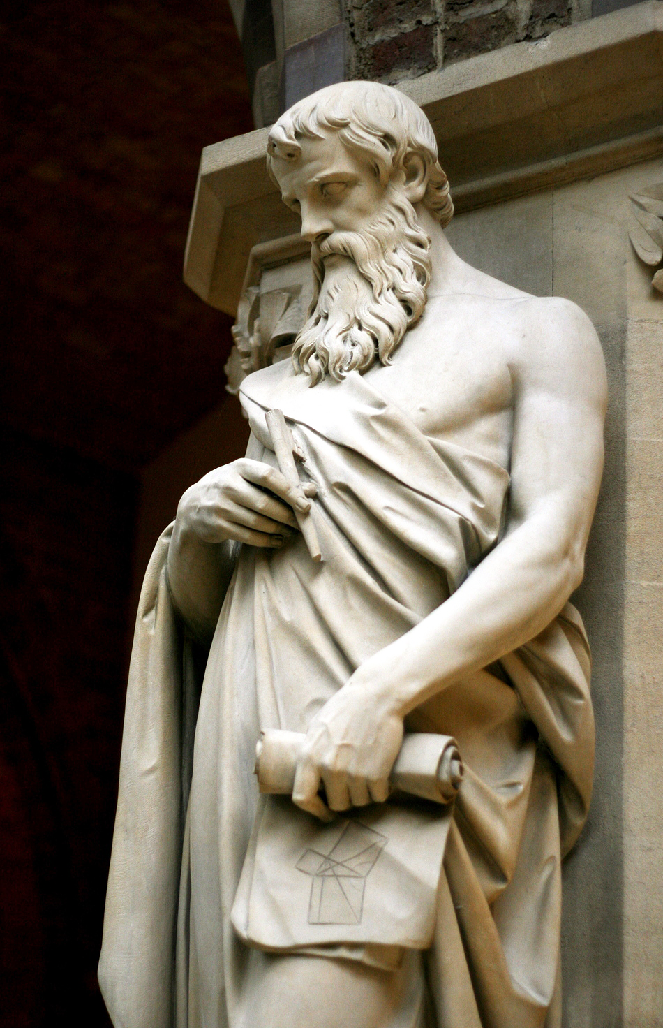 Statue of Euclid in the Oxford University Museum of Natural History, Great Britain. Euclid holds a scroll with a diagram of the Pythagorean theorem.