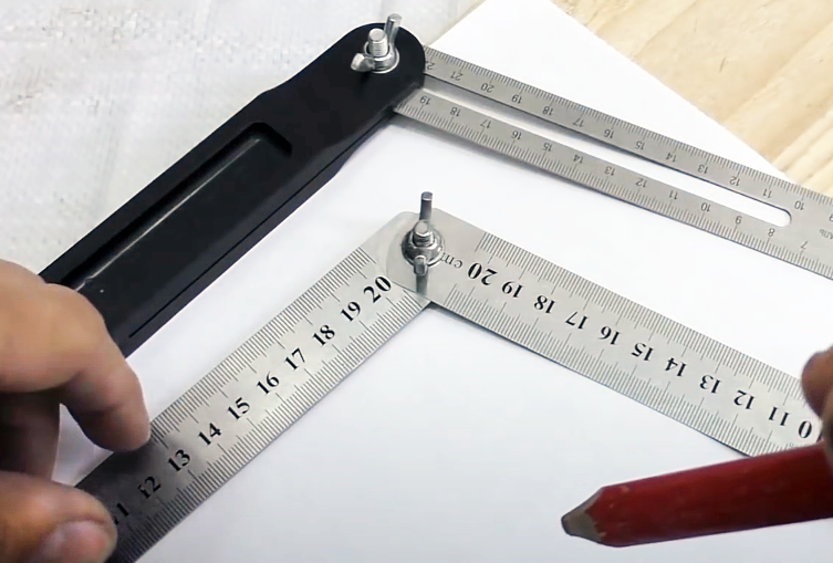 Homemade sliding bevel made from two rulers joined by a screw